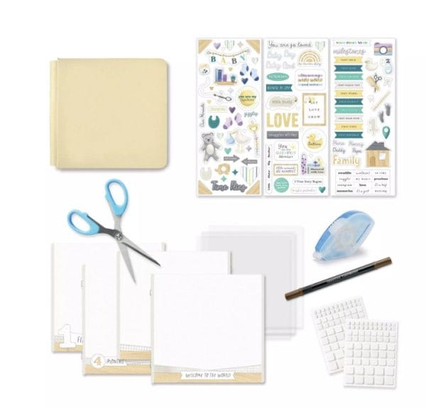 A display of the Creative Memories 8x8 lemon ice welcome baby kit. It includes the lemon ice album cover, three sheets of stickers, all purpose scissors, pre-printed pages, page protectors, a tape runner, dual-tip pen, and foam squares.