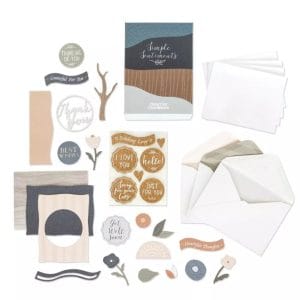 Contents of Creative Memories Simple Sentiments Card Kit with envelopes, card bases, and pre-cut pieces and sayings like "Miss You", "Get Well Soon", "Thank You" and "Sorry for Your Loss".