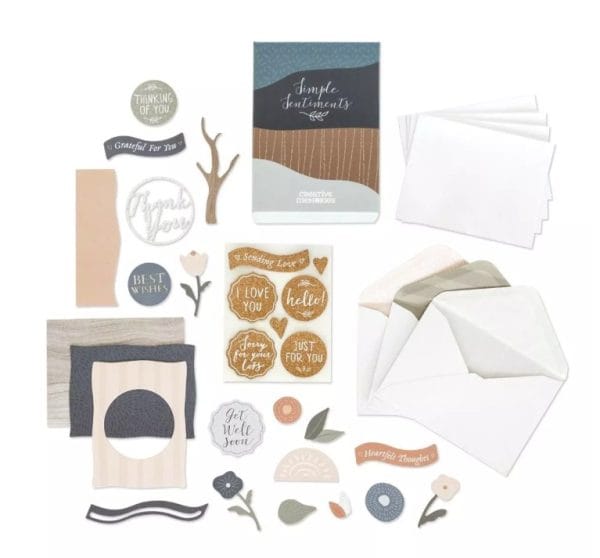 Contents of Creative Memories Simple Sentiments Card Kit with envelopes, card bases, and pre-cut pieces and sayings like "Miss You", "Get Well Soon", "Thank You" and "Sorry for Your Loss".