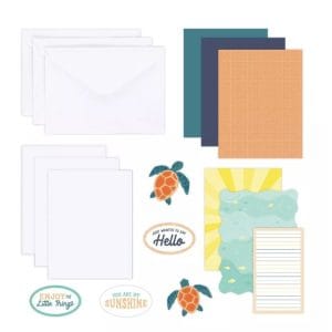 Contents of the Creative Memories Sun-Soaked Trio Card Kit, including card bases, envelopes and tropic-themed embellishments like sea turtles.